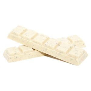 MOTA Cookies and Cream Chocolate bars. 2 white chocolate bars are left on the ground crossing each other.