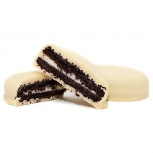 Two white thc-infused oreos sit on a white background. 