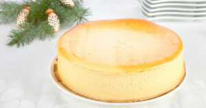 Bite-sized Keto cheese cake served on a white dish and table.