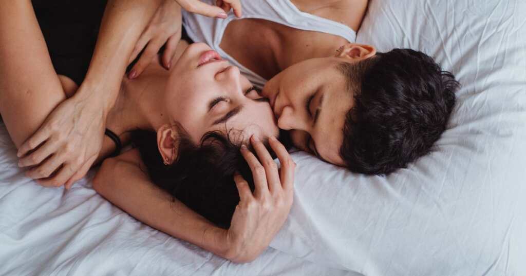 Intimate moments between a couple - laying in bed