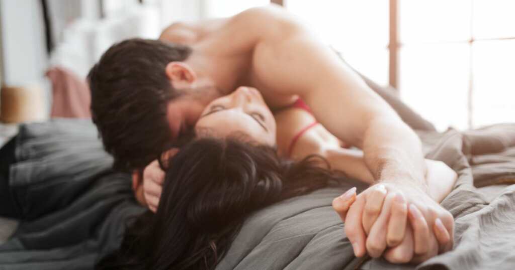Intimate moments - couple laying in bed