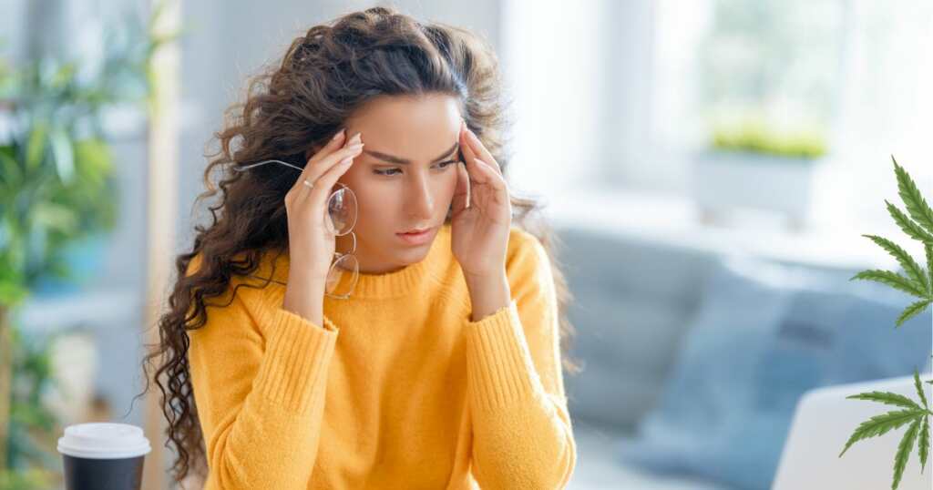 Woman with Migraine touching her head - needs relief - cannabis leaf