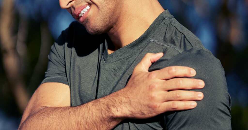 young male - touching his left arm - pain - fibromyalgia - needs relief