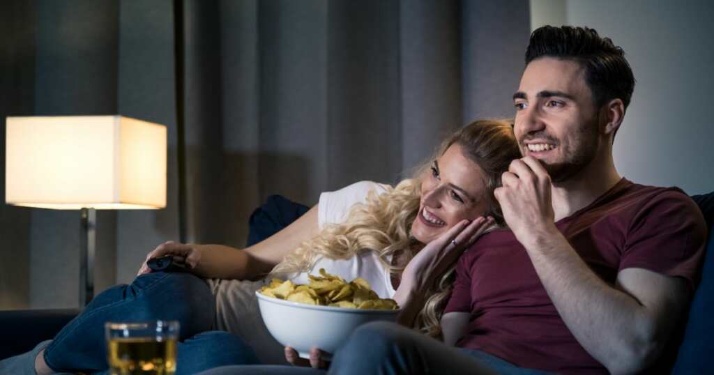 Couple enjoying while watching a movie