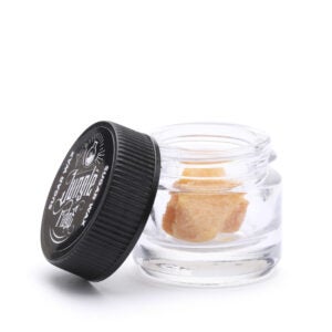 Cannabis wax from Jungle Ridge. Product sits in a high-quality glass container and plastic lid.