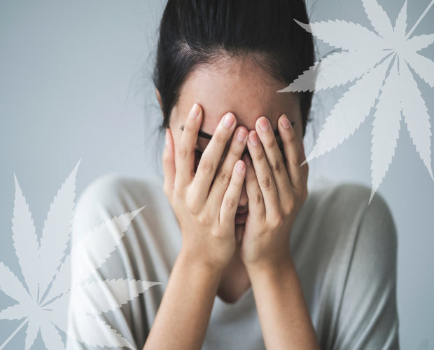 This image features a women suffering from anxiety for the article terpenes for anxiety.