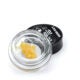 Jungle Ridge Live Resin. Products sits in a high-quality glass container placed next to a black plastic lid.