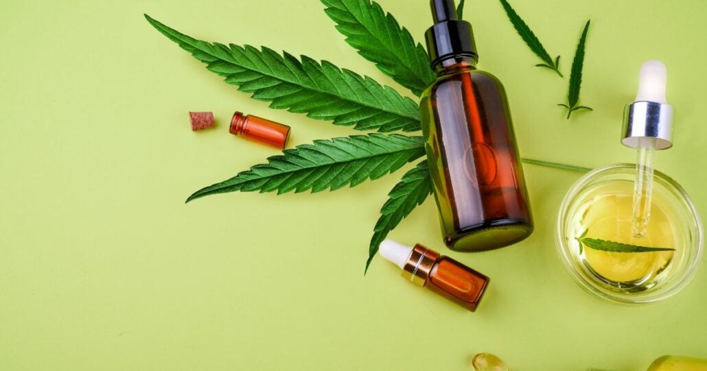 cannabis products on a green background.