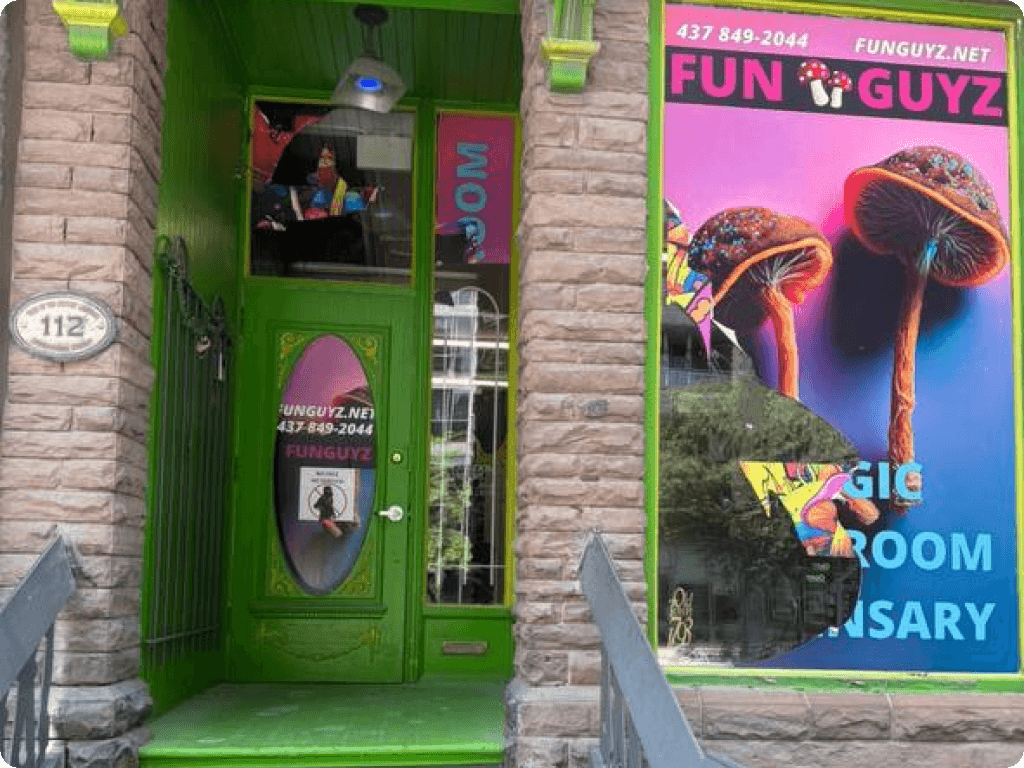 The storefront with a bright green door, from the outside, at Funguyz magic mushrooms dispensary in Toronto at 112 Sherbourne Street
