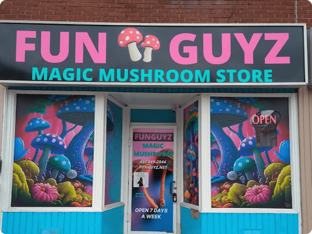 Blue storefront and big street signs of Funguyz magic mushrooms dispensary in Ottawa on Somerset Street West