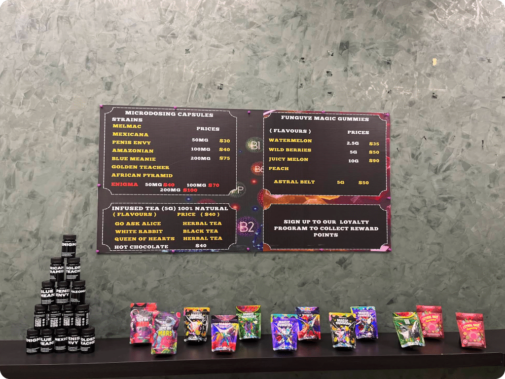 Shrooms and microdosing capsules on the store shelf at Four Winds Drive Funguyz dispensary