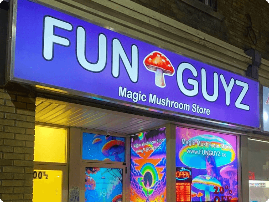 Bright neon sign of Funguyz magic mushrooms dispensary in Ottawa on Bank Street
