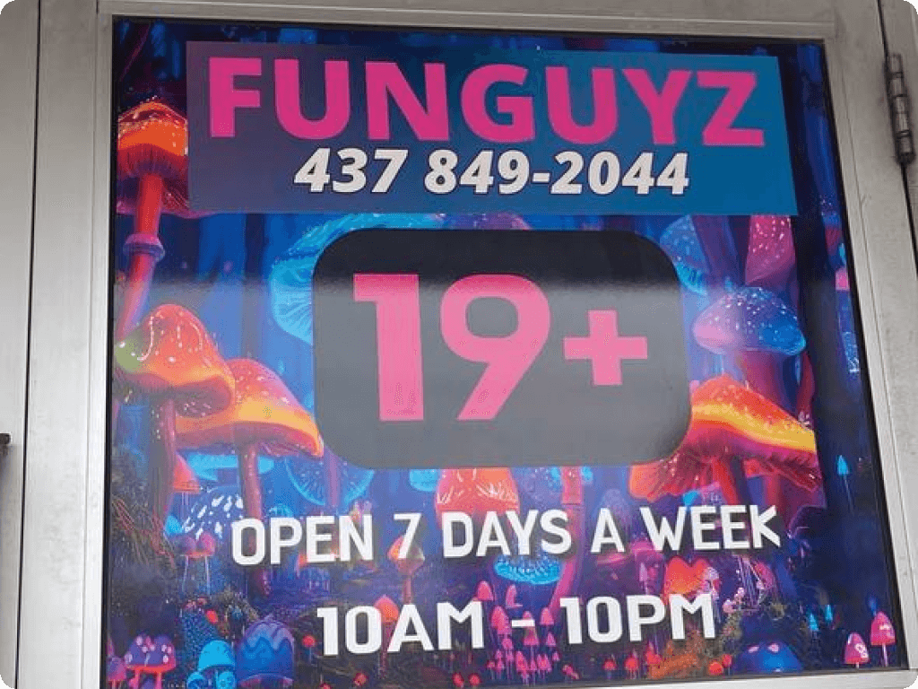 The 19+ sign on the storefront of Funguyz magic mushrooms dispensary in Ottawa on Churchill Ave