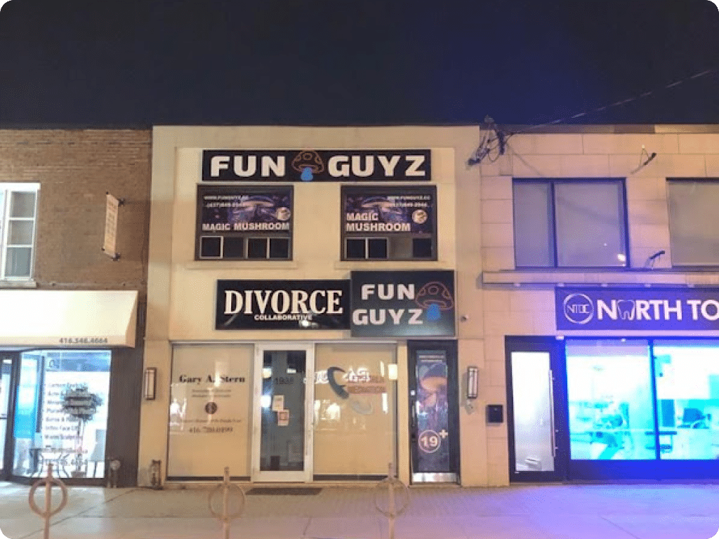 Funguyz North York, store at 1938 Avenue Rd, photo of the building at night with Funguyz signs visible