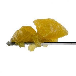 Live Resin sauce on a metal rod. Sticky orange substance sits on a silver metal rod.