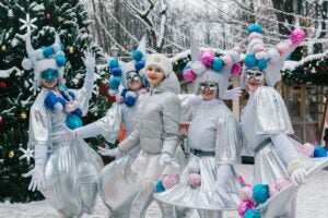 A picture of a group of young men & women dressed up in goofy-looking costumes.