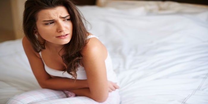 menstrual cramps woman bed best strain