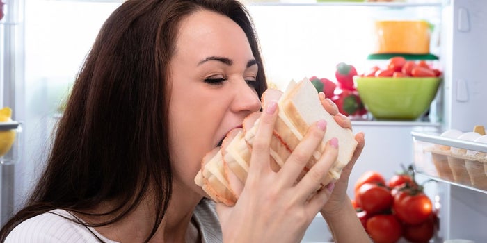 Young woman with a large appetite.