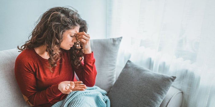 Woman suffering from a migraine.