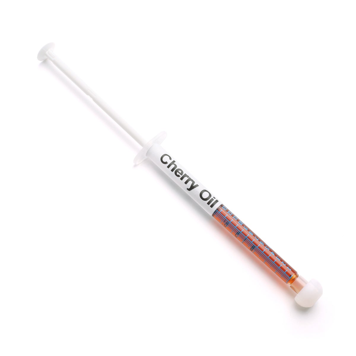 Cherry oil syringe from dark side dabs on a white background.