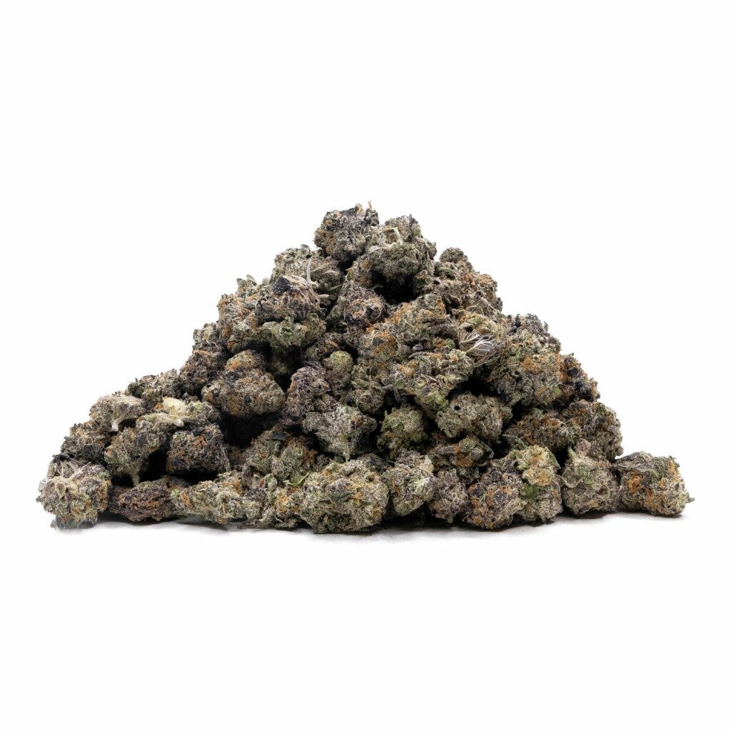 A pile of small applelicious buds, dark forest green with deep purple throughout, hints of orange pistols covered with trichomes.