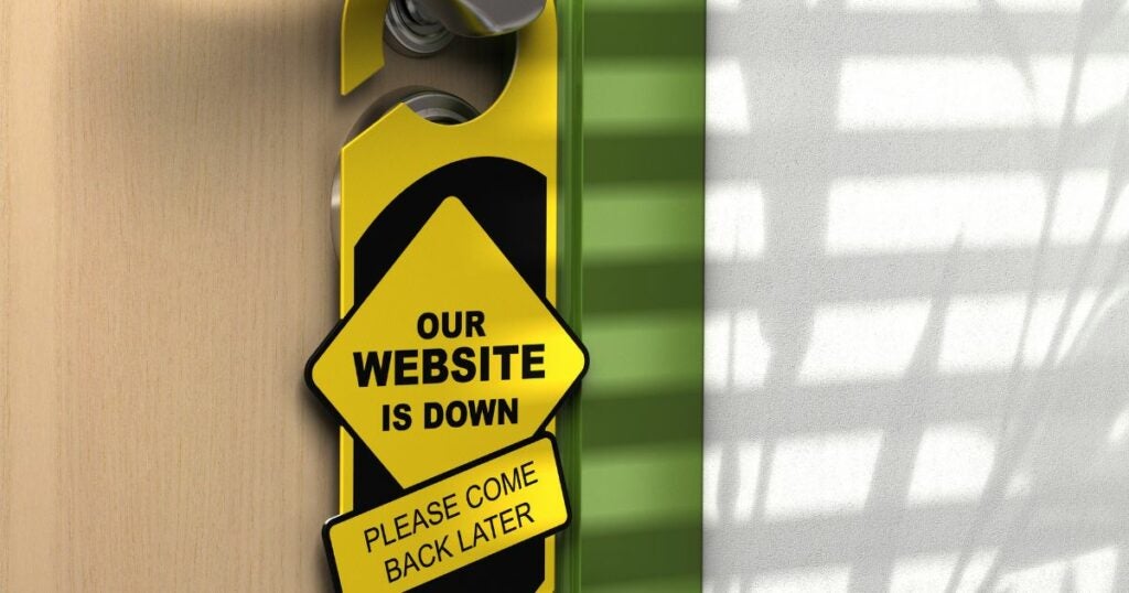 Yellow sign that reads "our website is down".