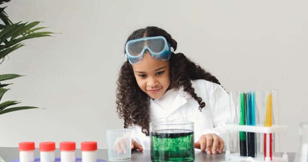 Young scientist working on her science project.