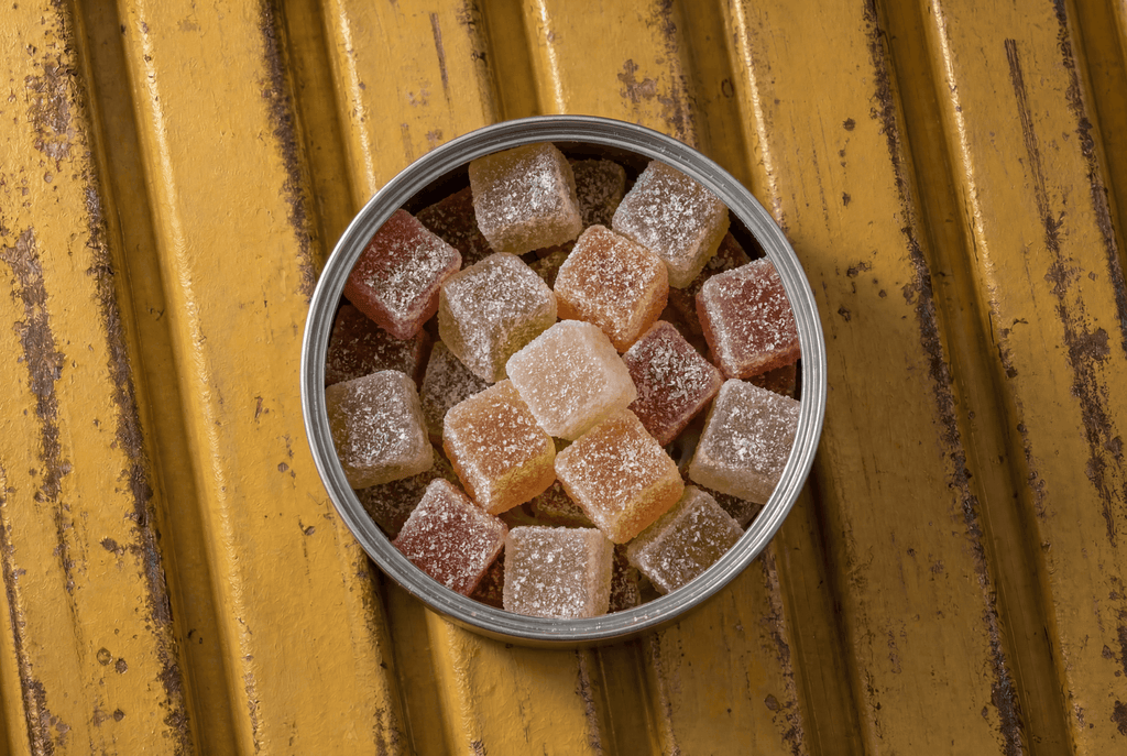 Cannabis gummy edibles in a tin jar