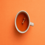 A cup of magic mushroom tea brewed with ginger, lemon, and herbs for intentional use