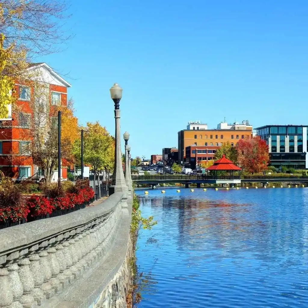 A scenic autumn view of a waterfront promenade in Sherbrooke