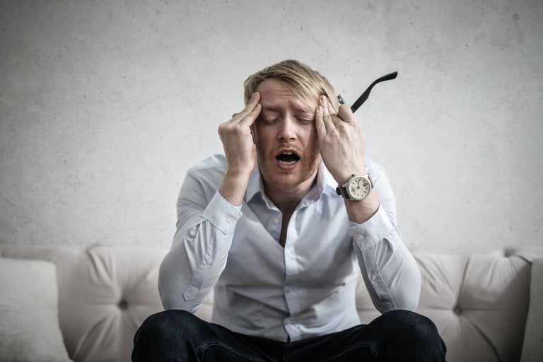 man having a headache