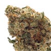 Extreme close-up of a Toast Bubba Kush bud showing dense frosty trichome detail