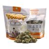 White and orange Toast MKU smalls pouch, 1oz, standing beside a heaped pile of small buds