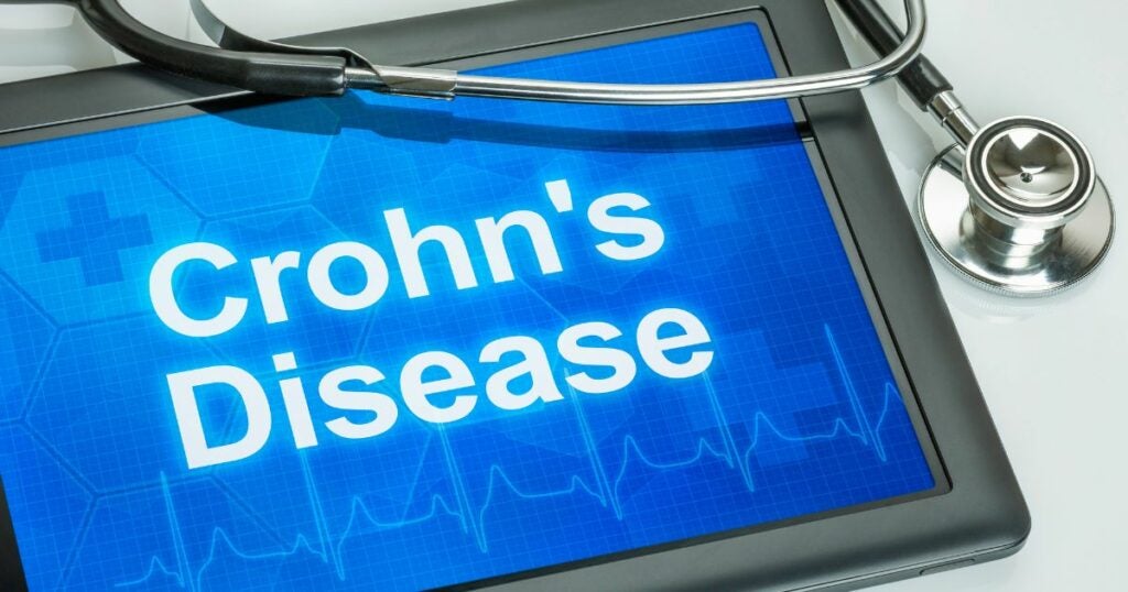 Cannabis for Crohn's Disease article featured image. Medical equipment with Crohn's disease written on it sits on a white background.