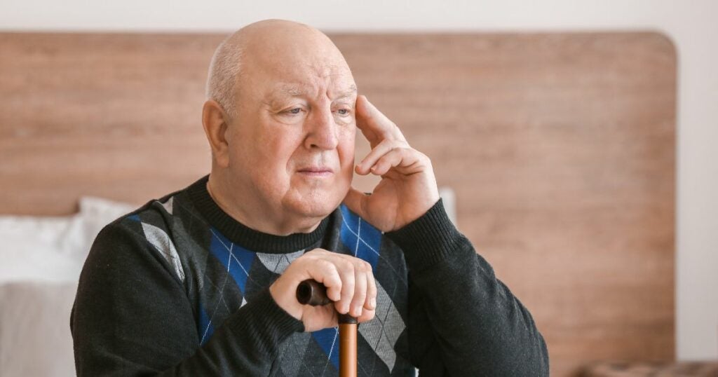 Elderly man - touching his head - Alzheimer's disease