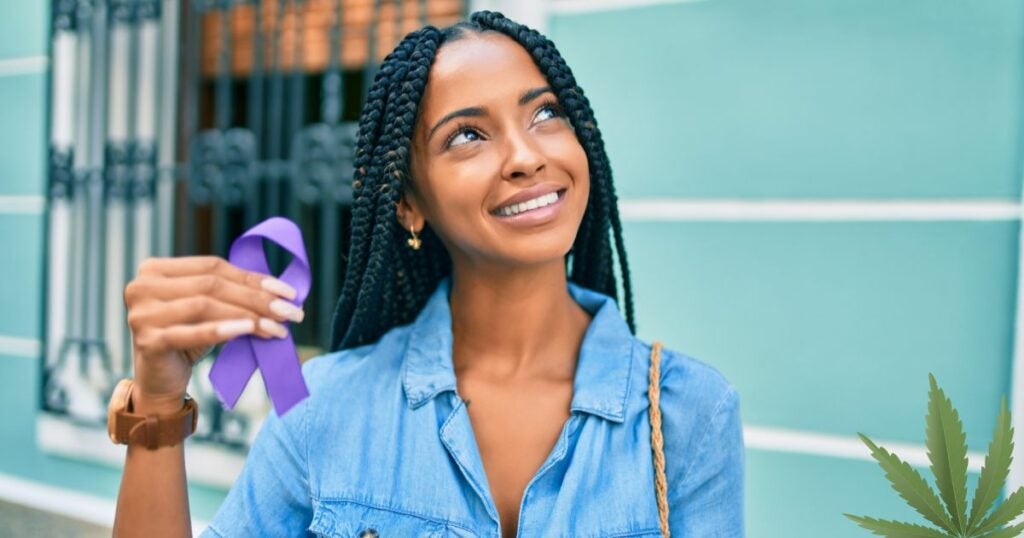 Fibromyalgia - woman holding a purple sign - cannabis leaf - best strain for relief - woman smiling