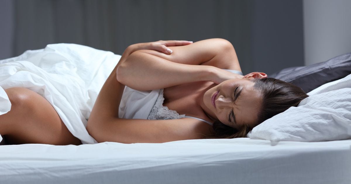 Woman laying in bed - fibromyalgia - Pain - needs relief