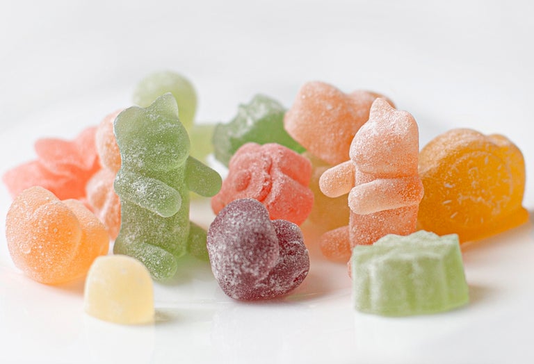 Sour CBD bear gummies on a white background.