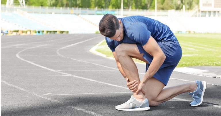 man with Muscle Spasms - muscle pain - runner